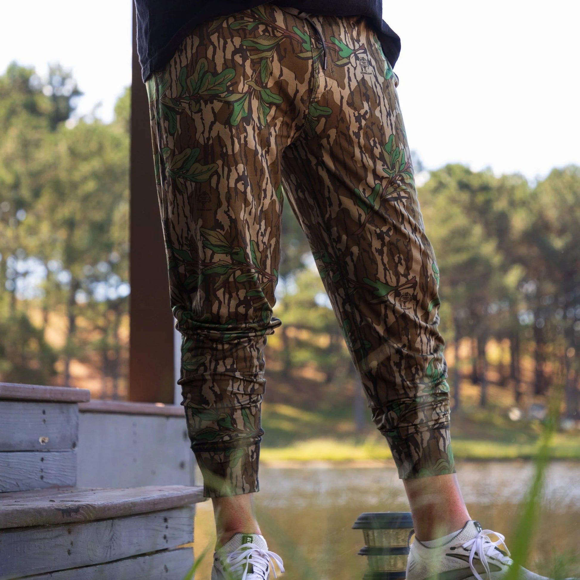 Men’s Mossy Oak camo joggers made with buttery soft performance fabric, athletic fit, and tapered leg design. 