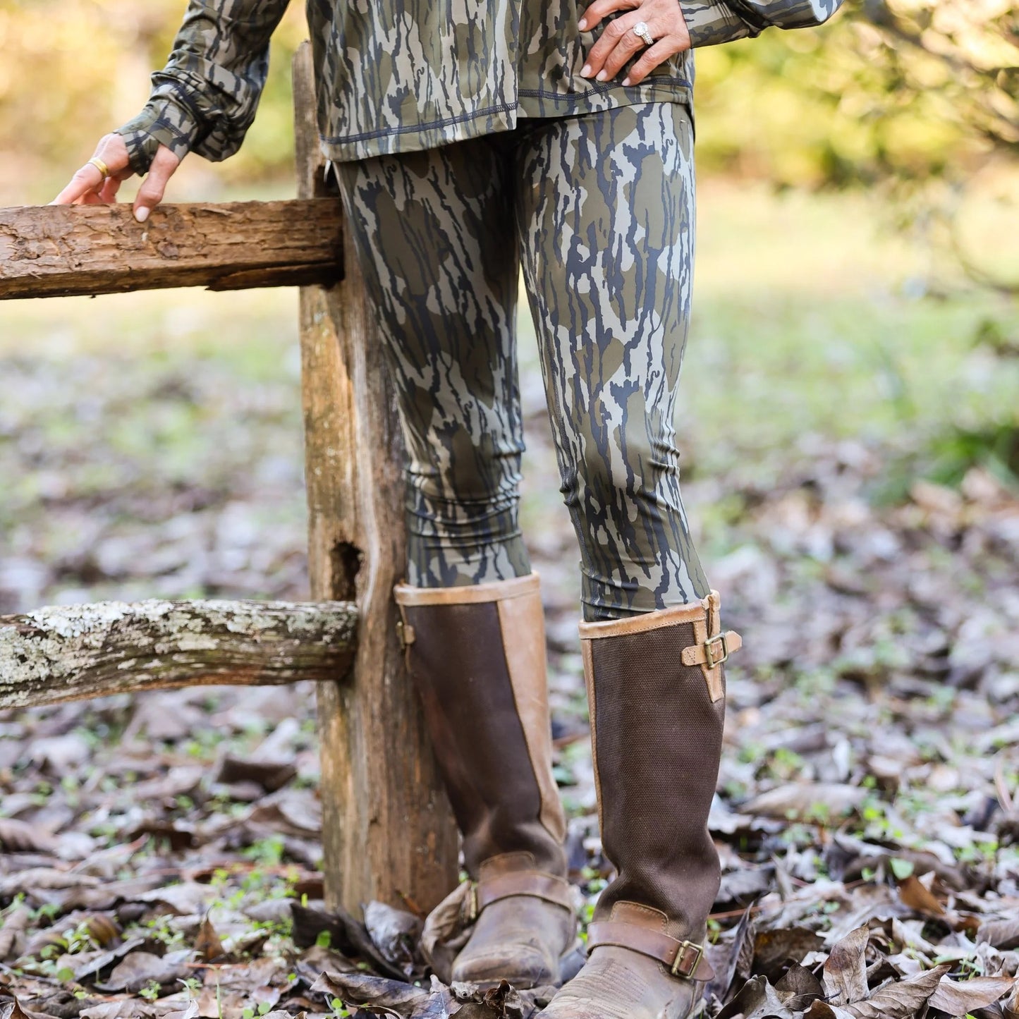 Model wearing Mossy Oak camo leggings to showcase performance fit, fabric detail and quality structure. 