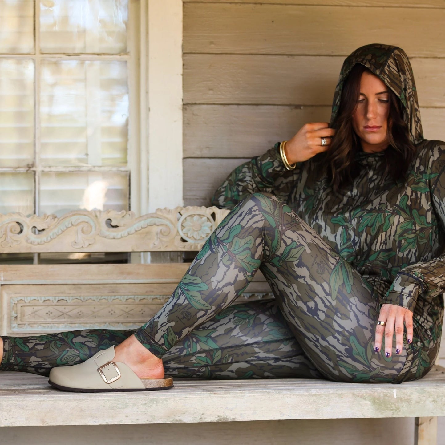 Model wearing women’s Mossy Oak camo leggings styled for outdoor use and every day wear. 
